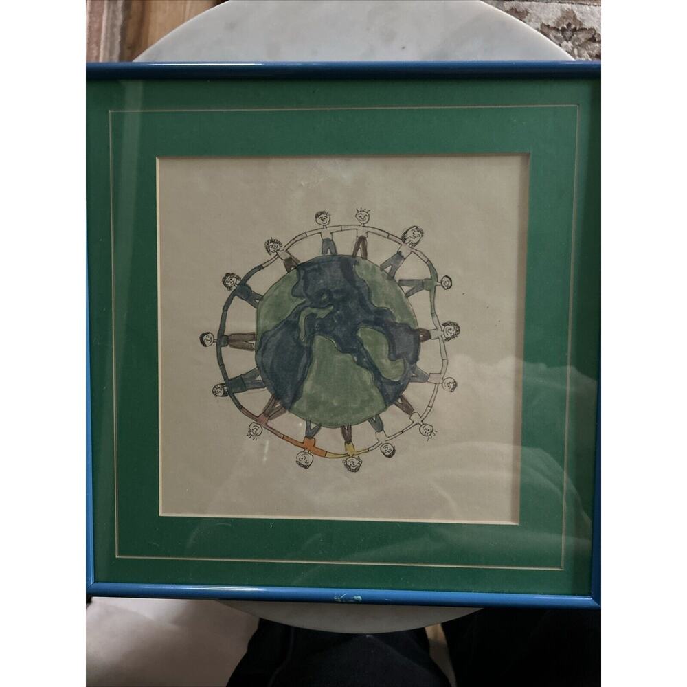 Framed drawing of children supporting the world